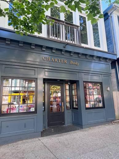 Charter Books storefront with large windows and a blue facade.