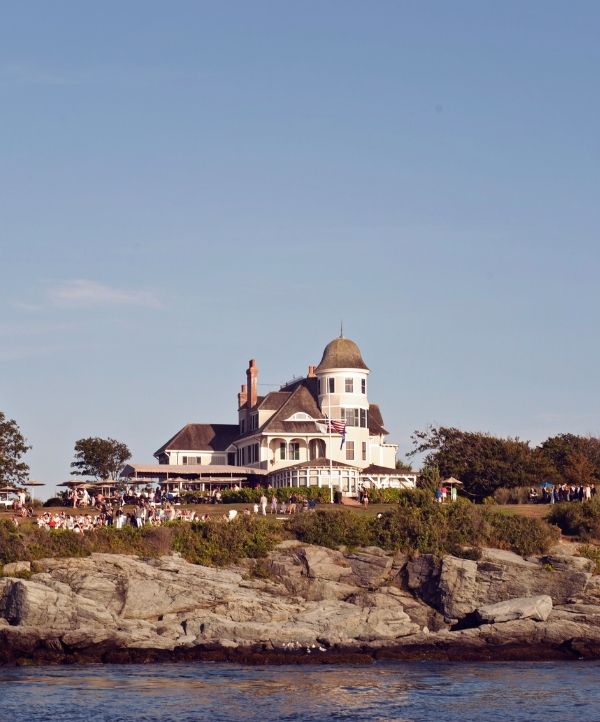 Castle Hill Inn exterior on top of rocky cliff over ocean at Castle Hill Inn in Newport, RI